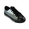A pair of shoes with black laces and a picture on them.