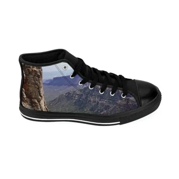A pair of shoes with a picture of a cat on them.
