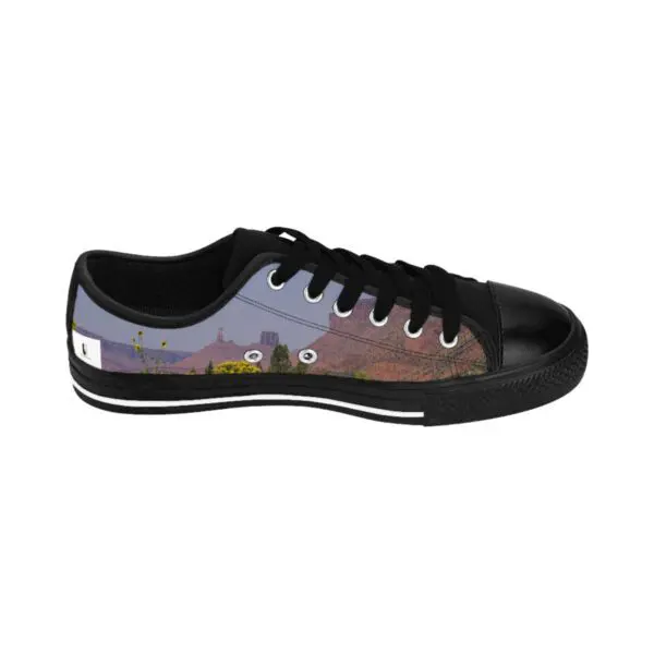 A pair of shoes with the image of a mountain.