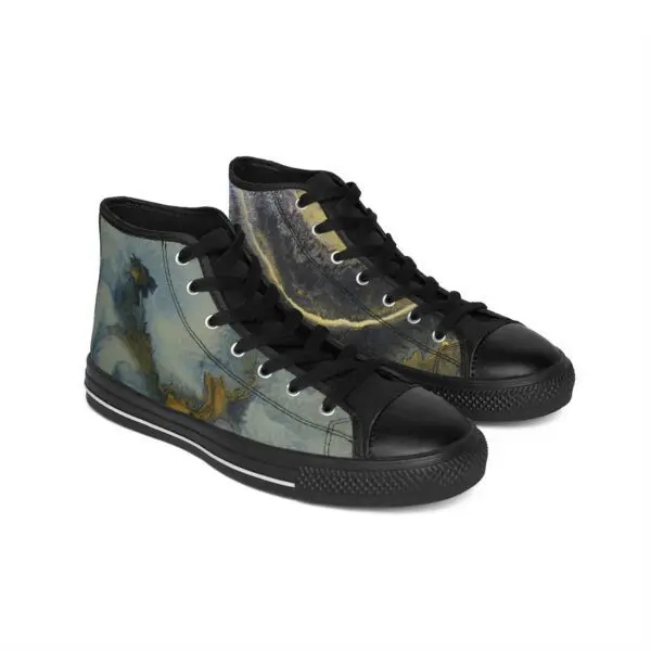 A pair of black shoes with a picture on them.