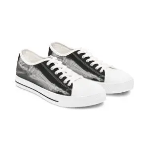 A pair of black and white sneakers on top of each other.