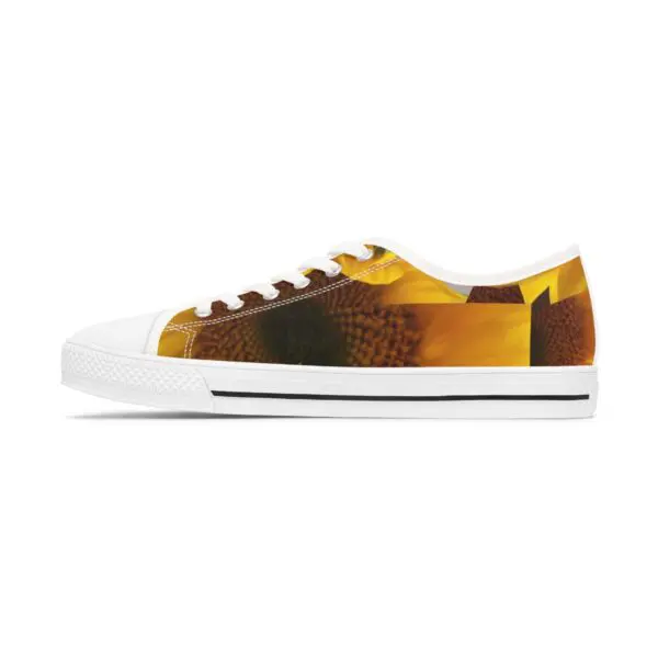 A pair of shoes with yellow and brown designs on them.