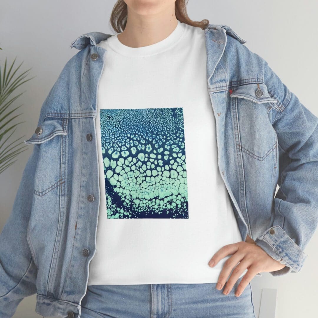Denim jacket over white tee with aqua print