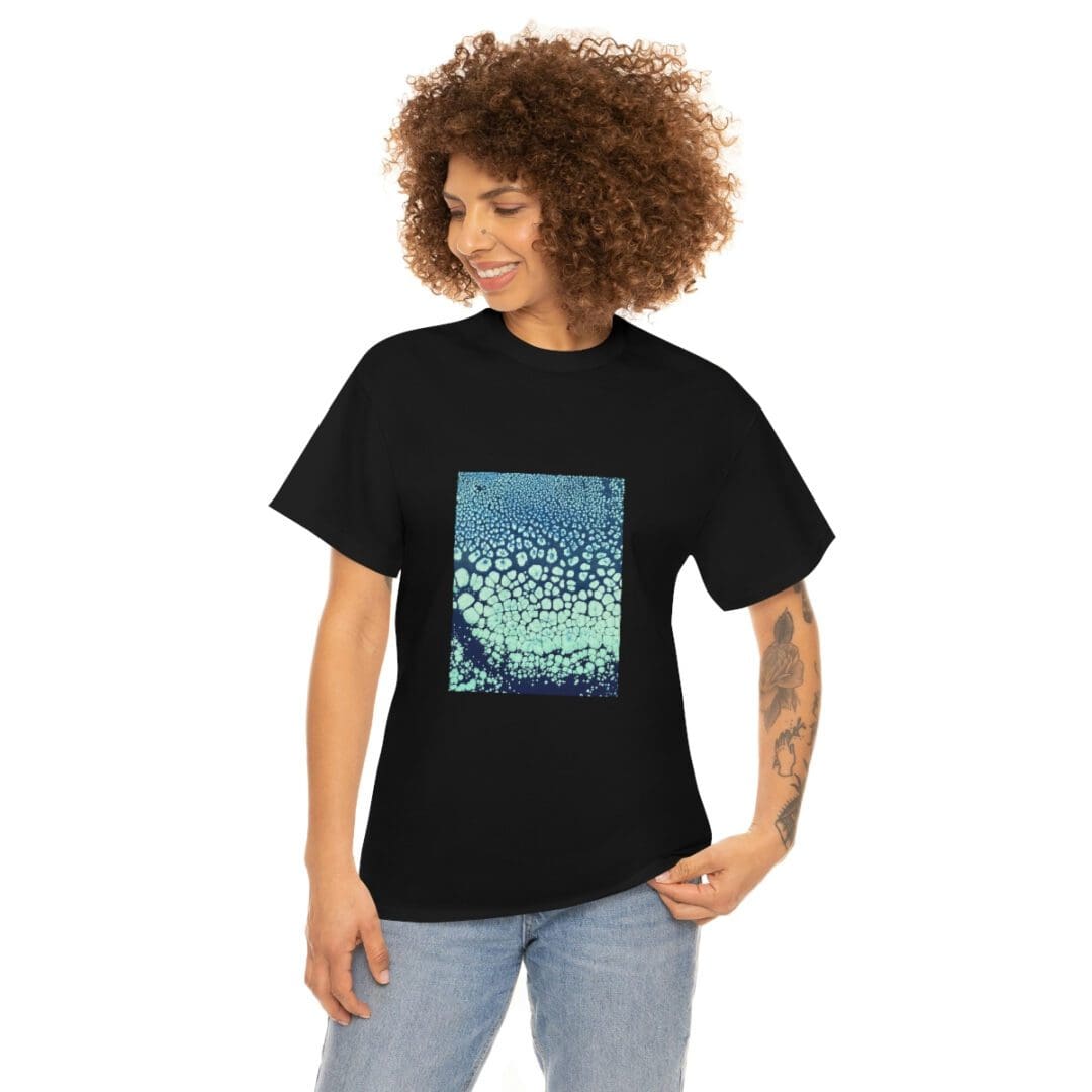 Smiling woman modeling black tee with blue print