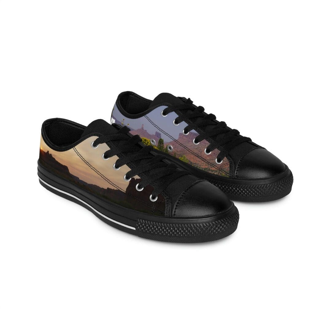 Black low-top sneakers with sunset print