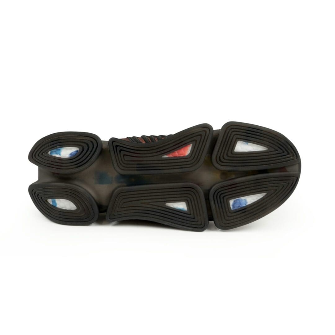 A shoe with some black and red on it