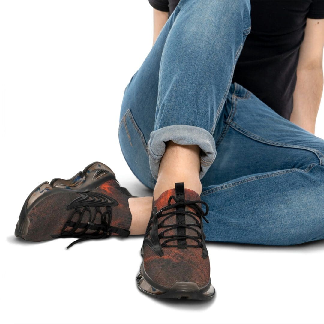 A person sitting on the ground with their feet up.