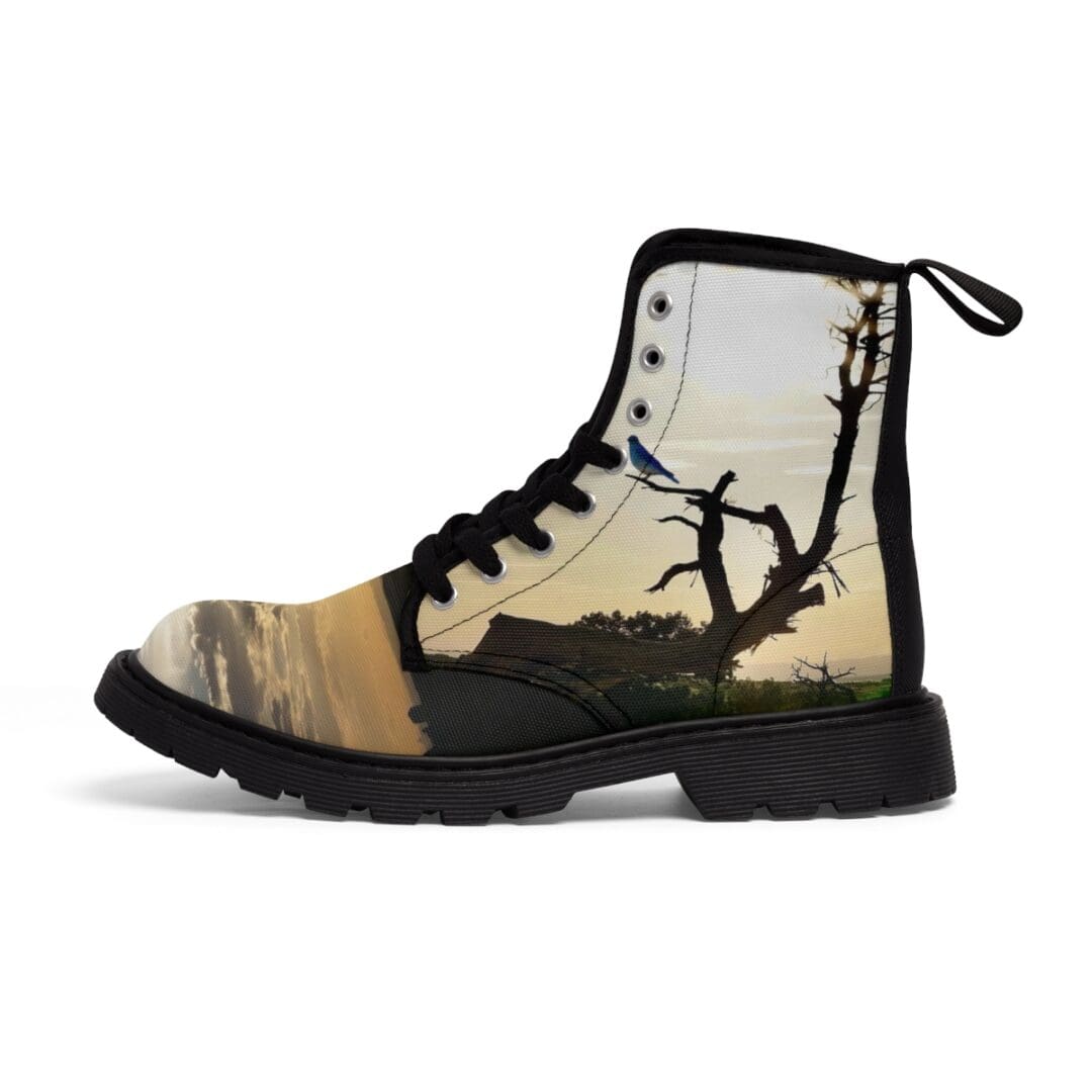 A pair of boots with a picture of trees and birds.