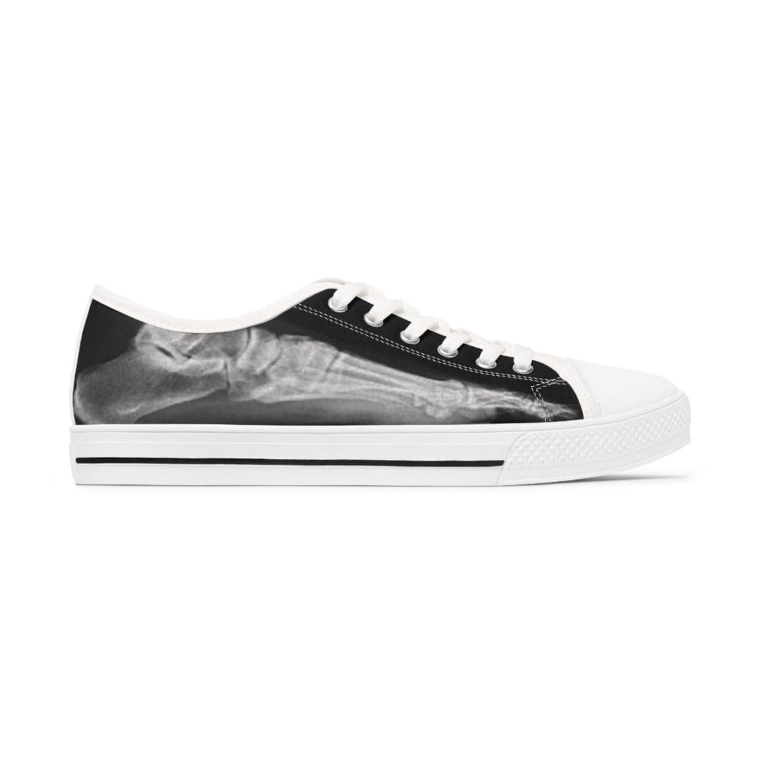 A pair of black and white sneakers with a picture on them.